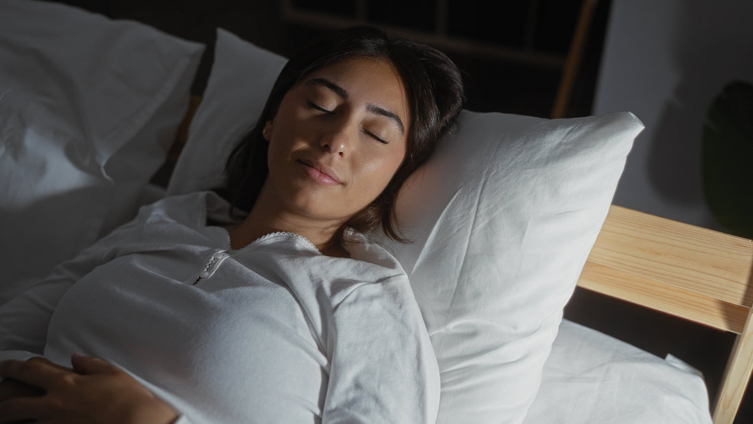 Pregnant woman resting peacefully in a comfortable bed